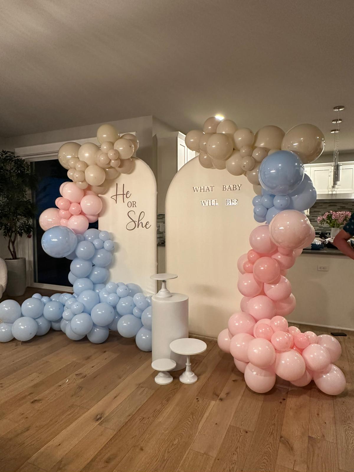Warm toned baby shower balloon garland hallway