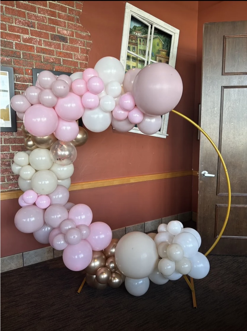 He or She gender reveal arch with pink and blue