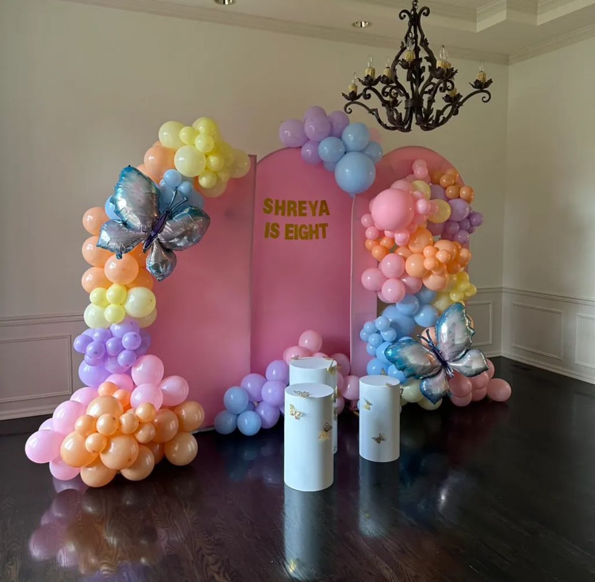 Sweet 16 pink gold balloon arch with marquee numbers