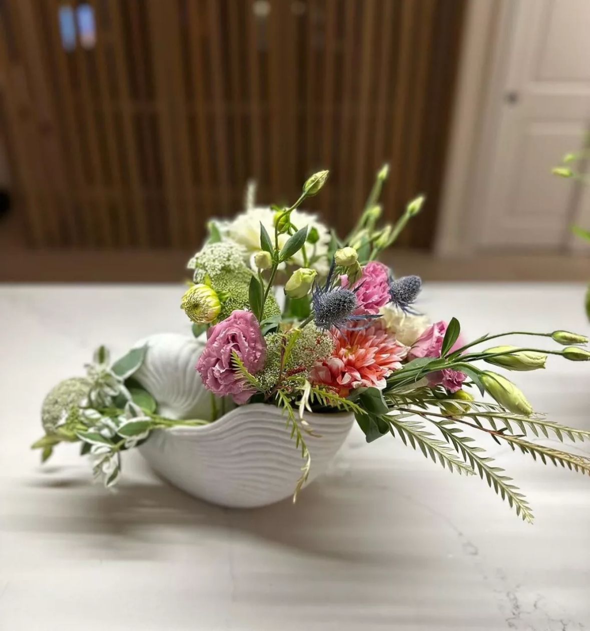 Pink gerbera daisy and peony arrangement