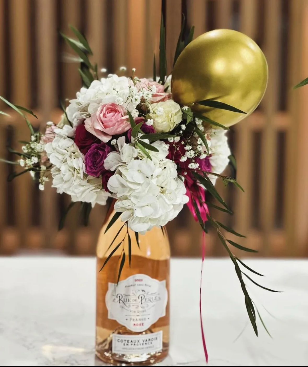 Purple lavender roses in martini vase
